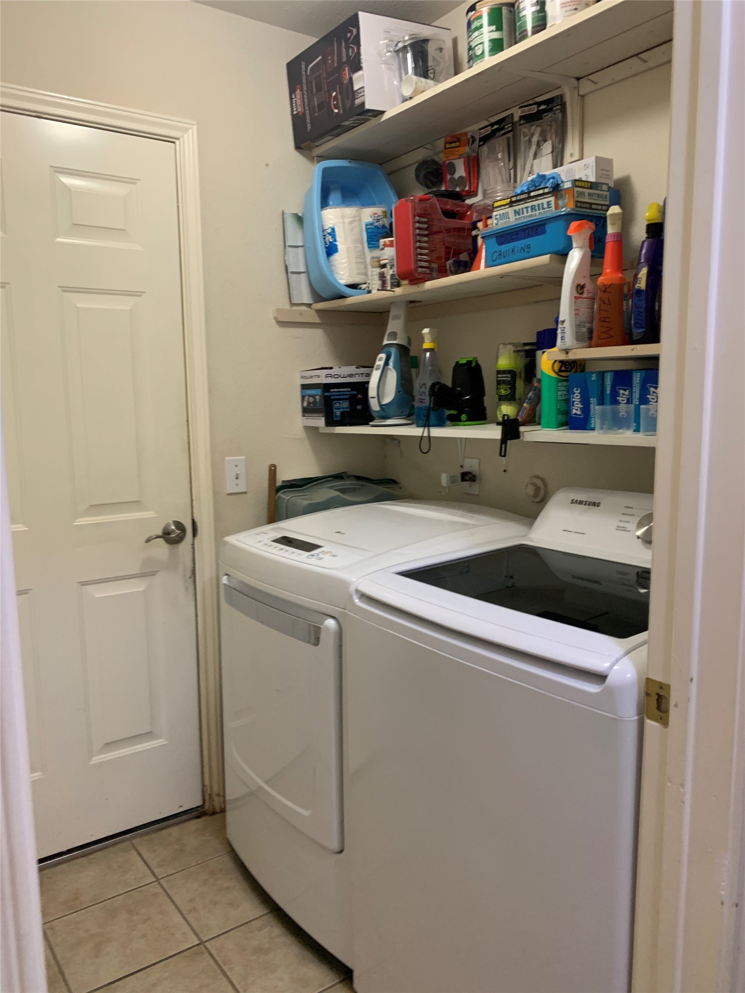 150 Elmer Cove Kyle, TX 78640 - Photo 8 of 11 a utility room with dryer and washer