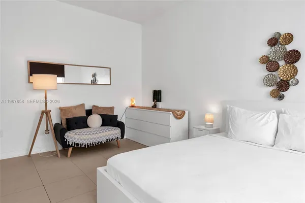a bedroom with a bed and closet