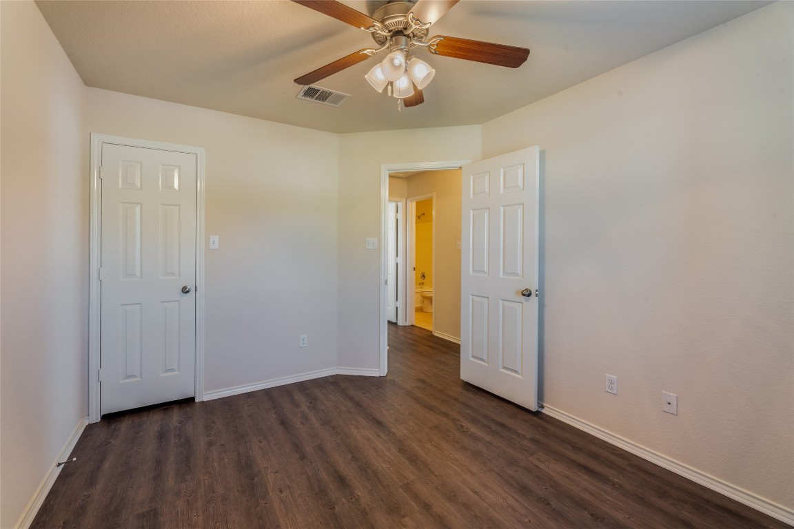 200 Falcon Lane Leander, TX 78641 - Photo 16 of 20 Spare room featuring dark wood-style flooring and a ceiling fan