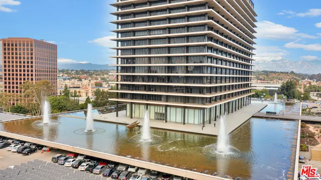a view of a yard with plants and flowers
