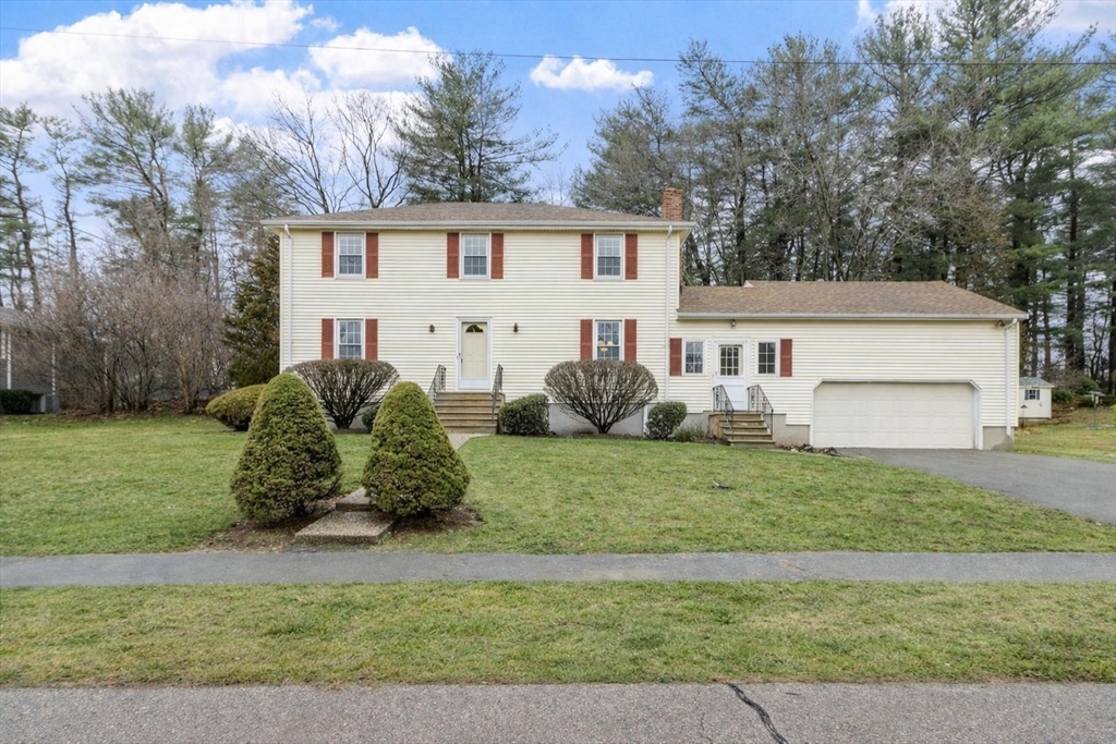 61 Beaver Road Reading, MA 01867 - Photo 1 of 39 a view of a house with a back yard