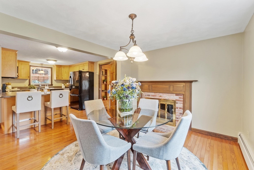 61 Beaver Road Reading, MA 01867 - Photo 14 of 39 a view of a dining room with furniture and wooden floor