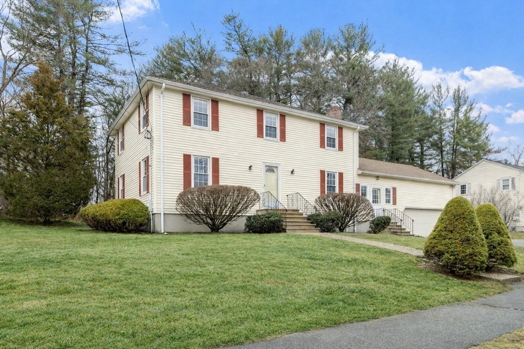 61 Beaver Road Reading, MA 01867 - Photo 2 of 39 a view of a house with a yard