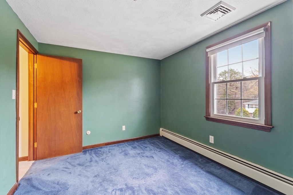 61 Beaver Road Reading, MA 01867 - Photo 29 of 39 an empty room with windows