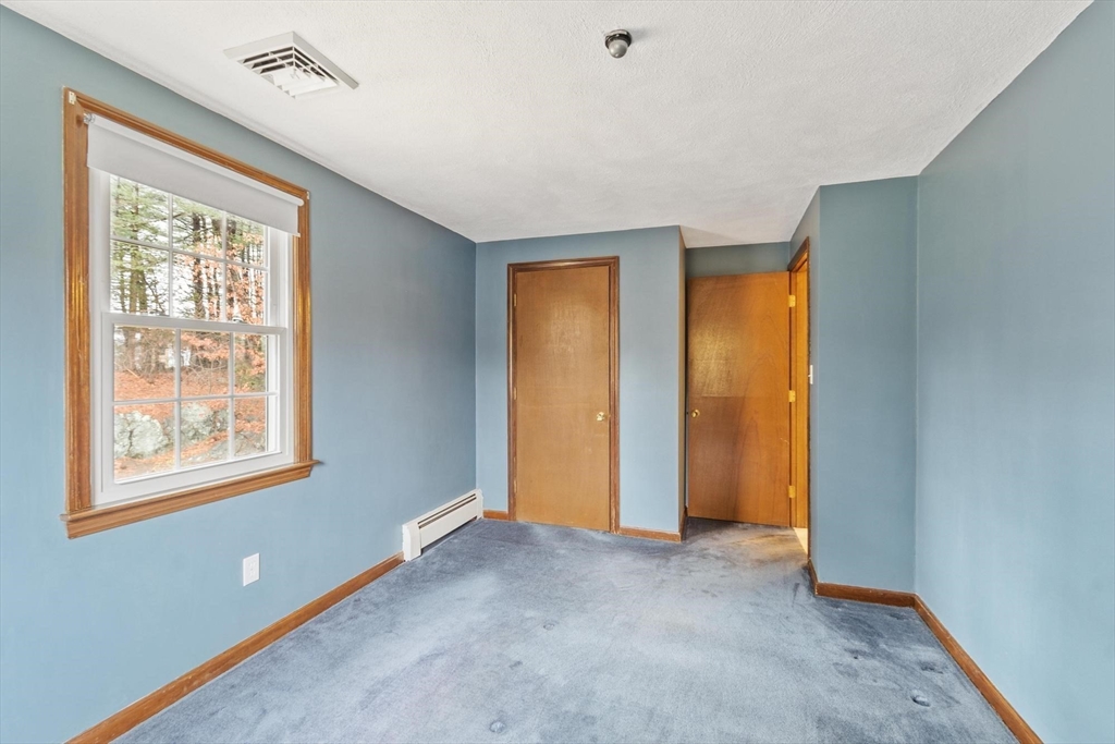 61 Beaver Road Reading, MA 01867 - Photo 31 of 39 a view of an empty room with a window