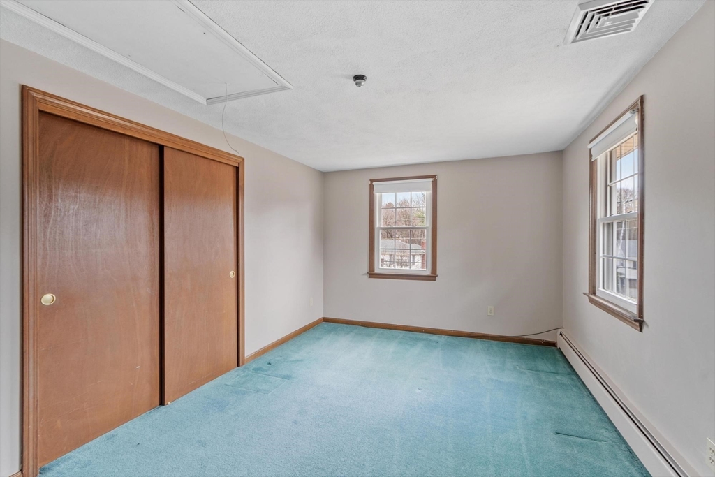 61 Beaver Road Reading, MA 01867 - Photo 32 of 39 a view of an empty room with window