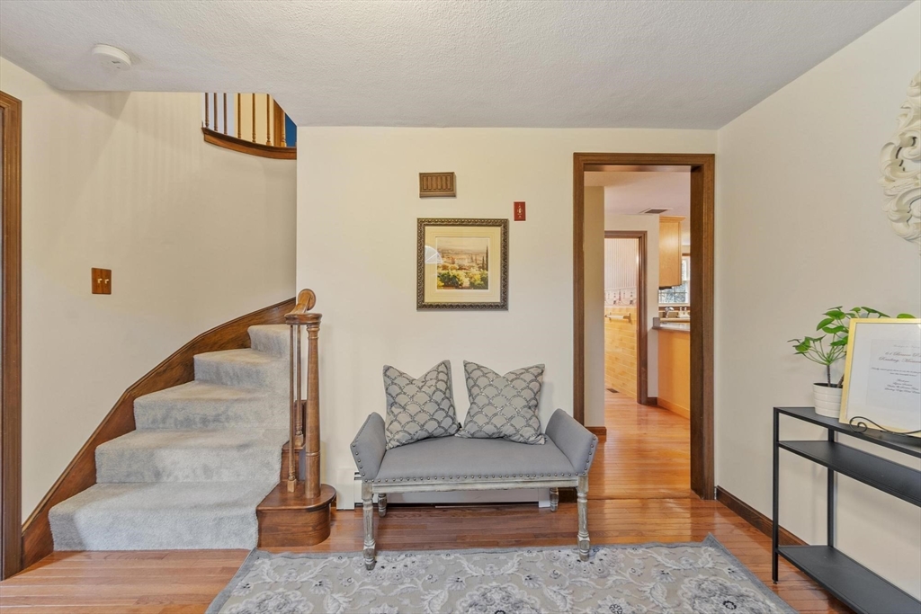 61 Beaver Road Reading, MA 01867 - Photo 4 of 39 a living room with furniture and wooden floor