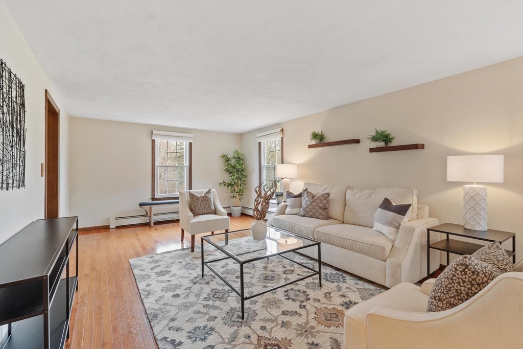 61 Beaver Road Reading, MA 01867 - Photo 6 of 39 a living room with furniture and wooden floor