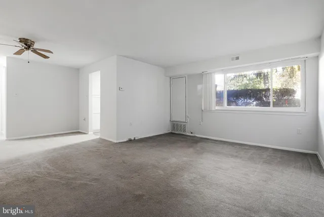 an empty room with windows