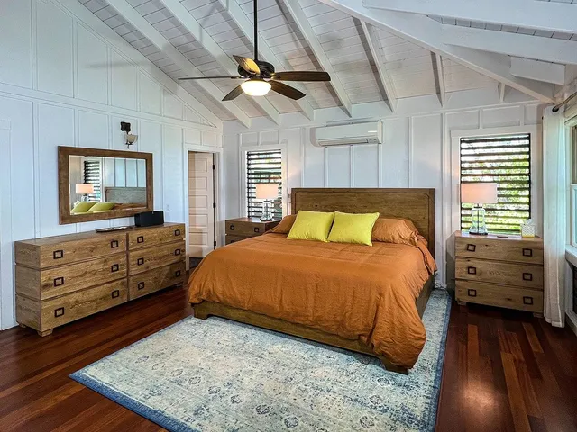 a bedroom with a bed and a dresser