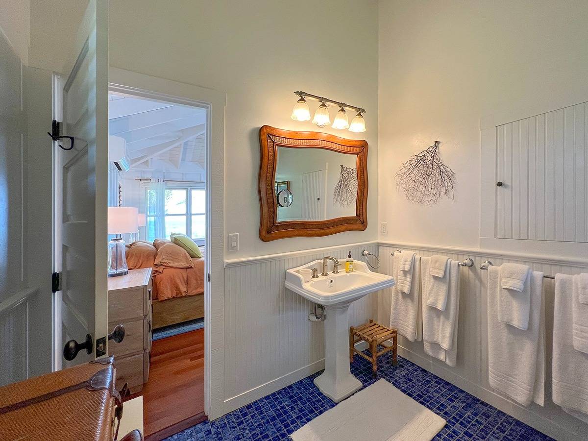 7324 Alealea Road Hanalei, HI 96714 - Photo 13 of 30 a bathroom with a sink mirror and toilet