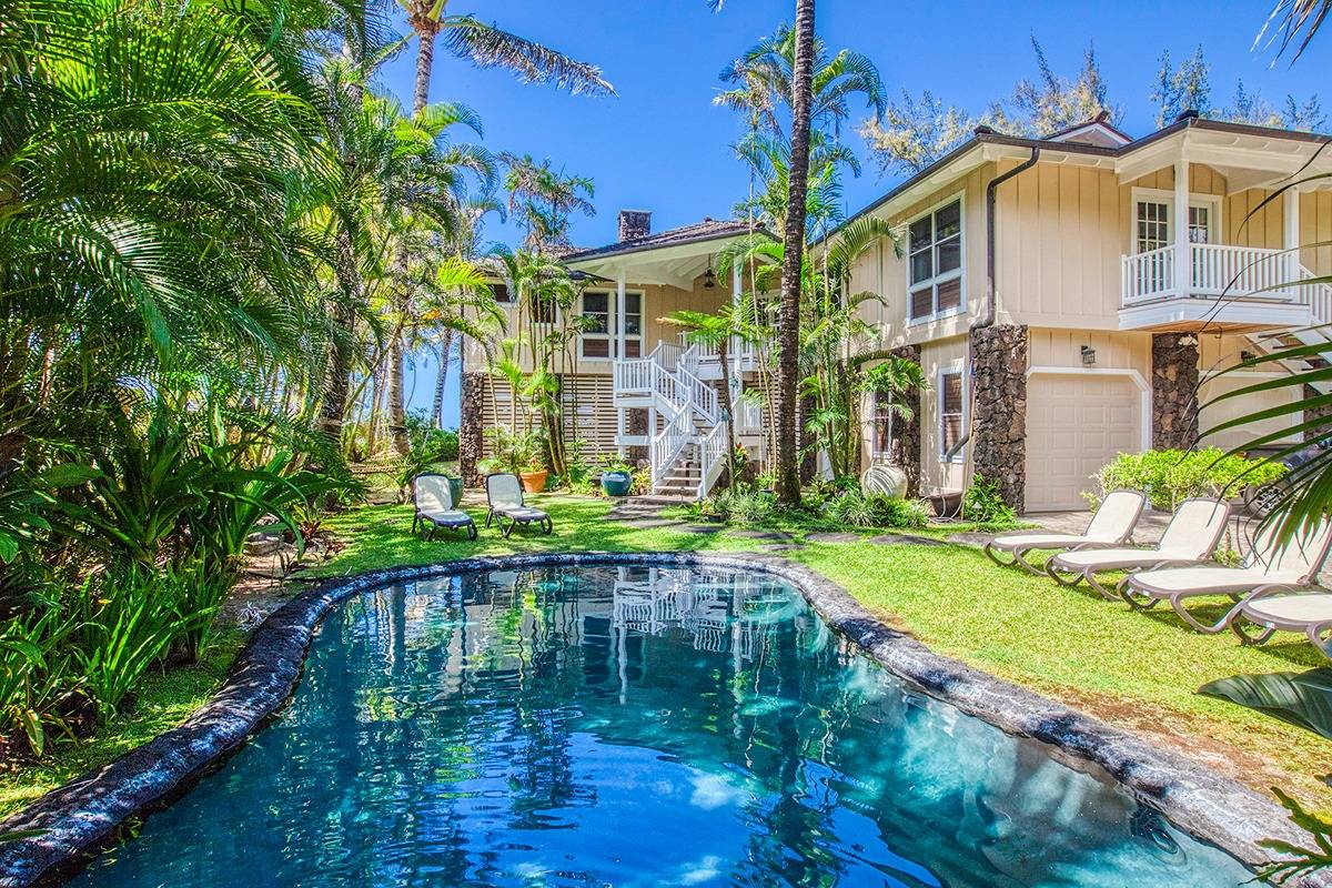 7324 Alealea Road Hanalei, HI 96714 - Photo 25 of 30 a backyard of a house with a garden and lake view
