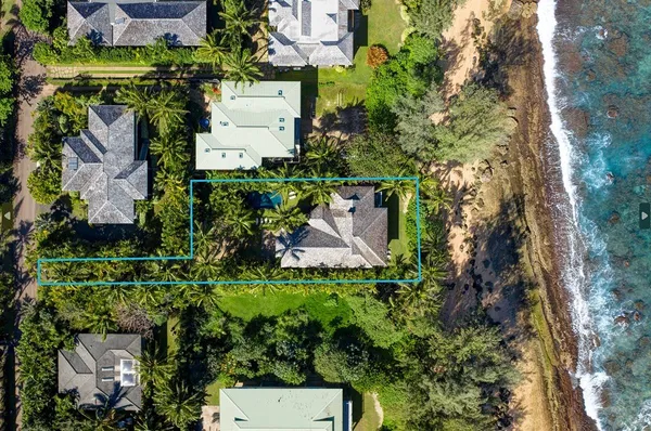 an aerial view of a house with a garden