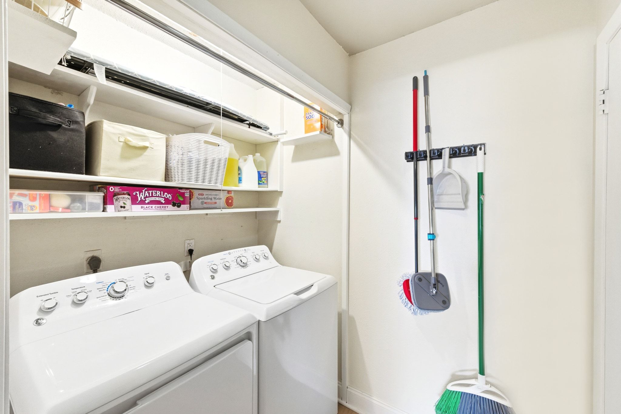 7210 Towering Oaks Drive Austin, TX 78745 - Photo 27 of 38 The in home laundry room is off the kitchen and comes with storage shelving and side by side laundry hookups.