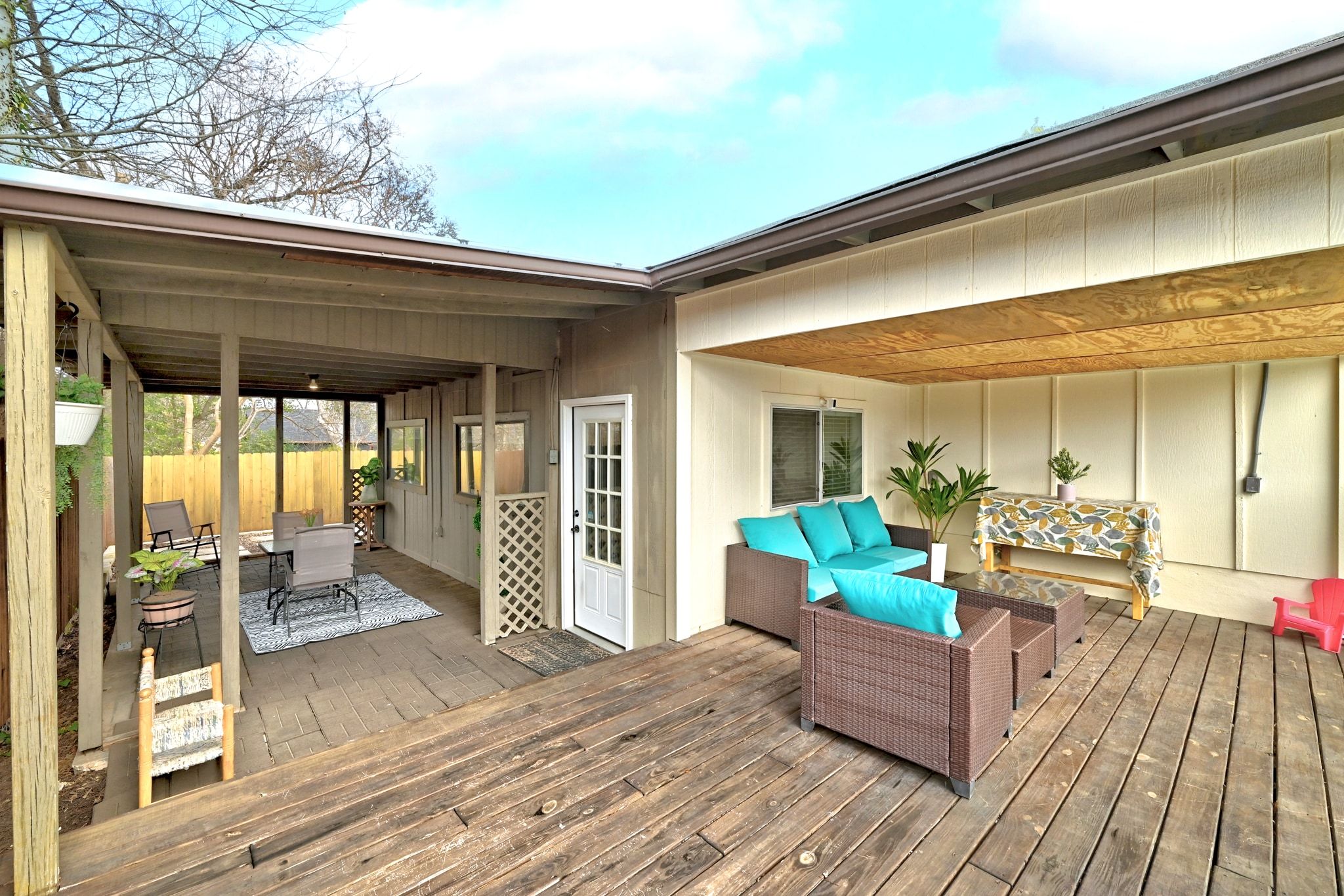 7210 Towering Oaks Drive Austin, TX 78745 - Photo 30 of 38 A deck addition stretches off the porch and comes with updated stain.