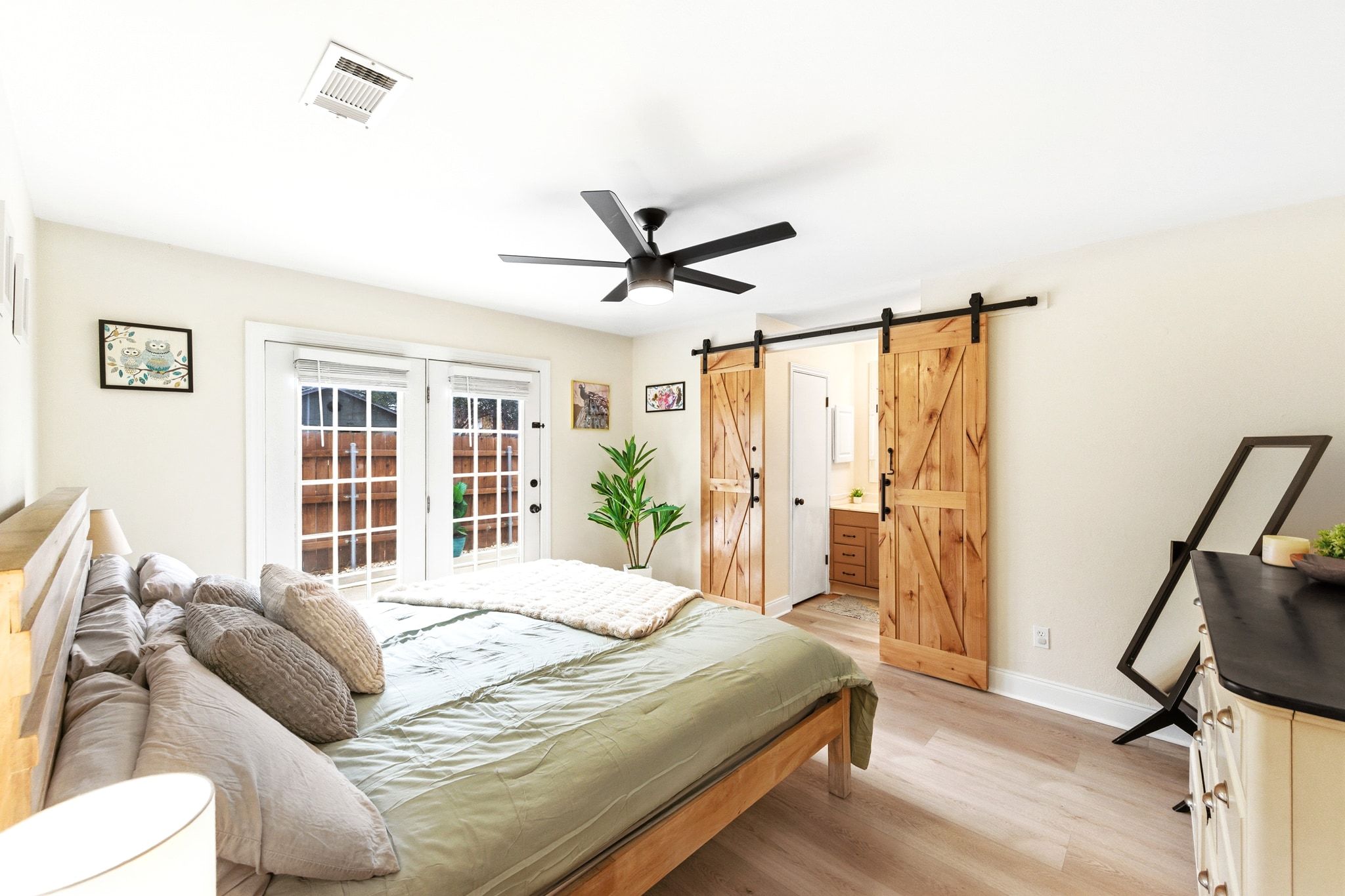 7210 Towering Oaks Drive Austin, TX 78745 - Photo 6 of 38 a bedroom with a bed and a large window