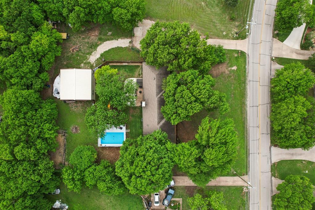 305 South Cockrell Hill Road Ovilla, TX 75154 - Photo 38 of 40 an aerial view of a house with a yard and large trees