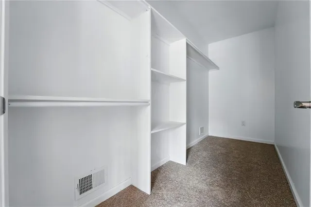 a view of an empty walk in closet