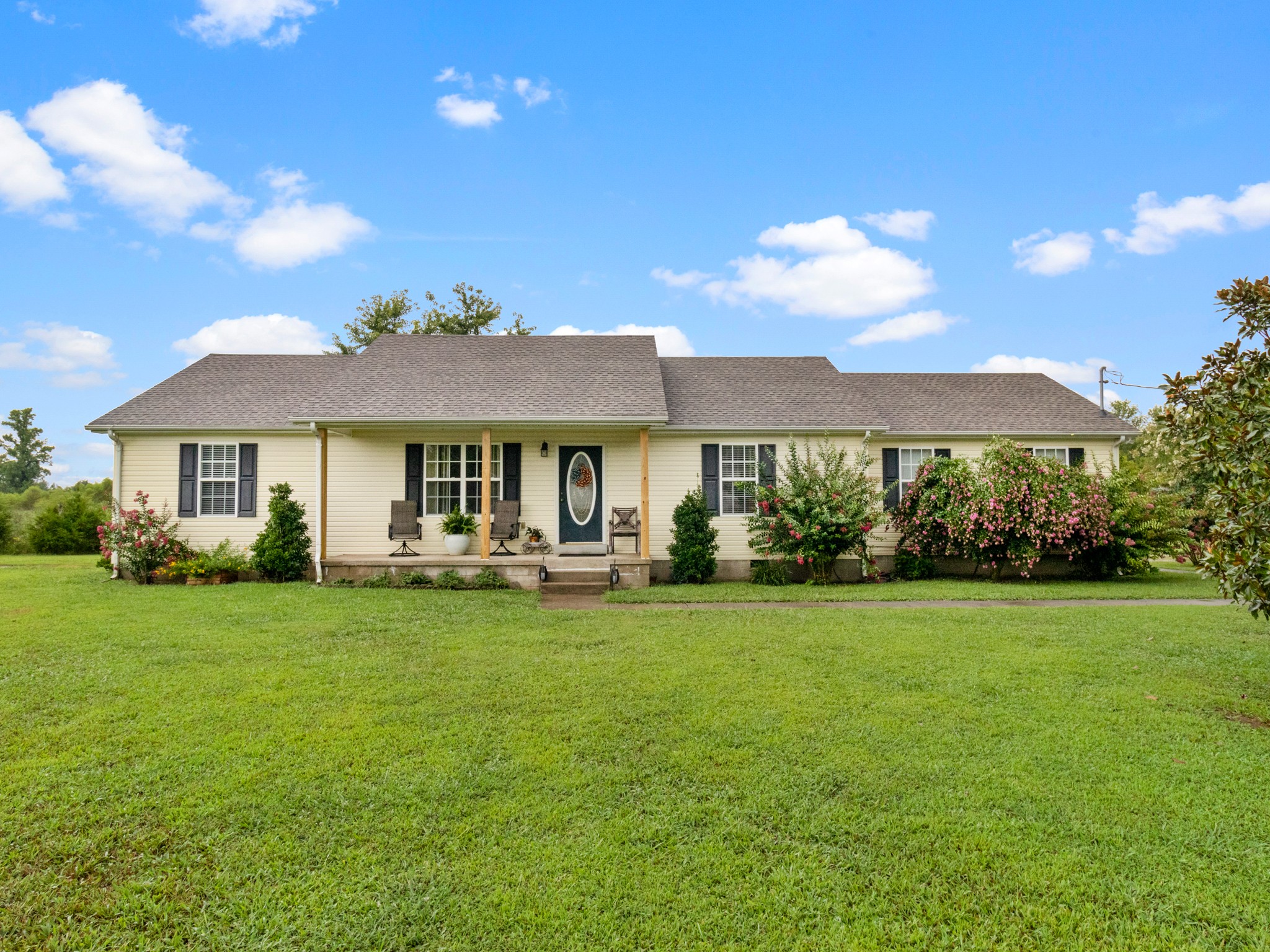 141 Sudberry Road Bell Buckle, TN 37020 - Photo 1 of 33 a front view of a house with swimming pool having outdoor seating
