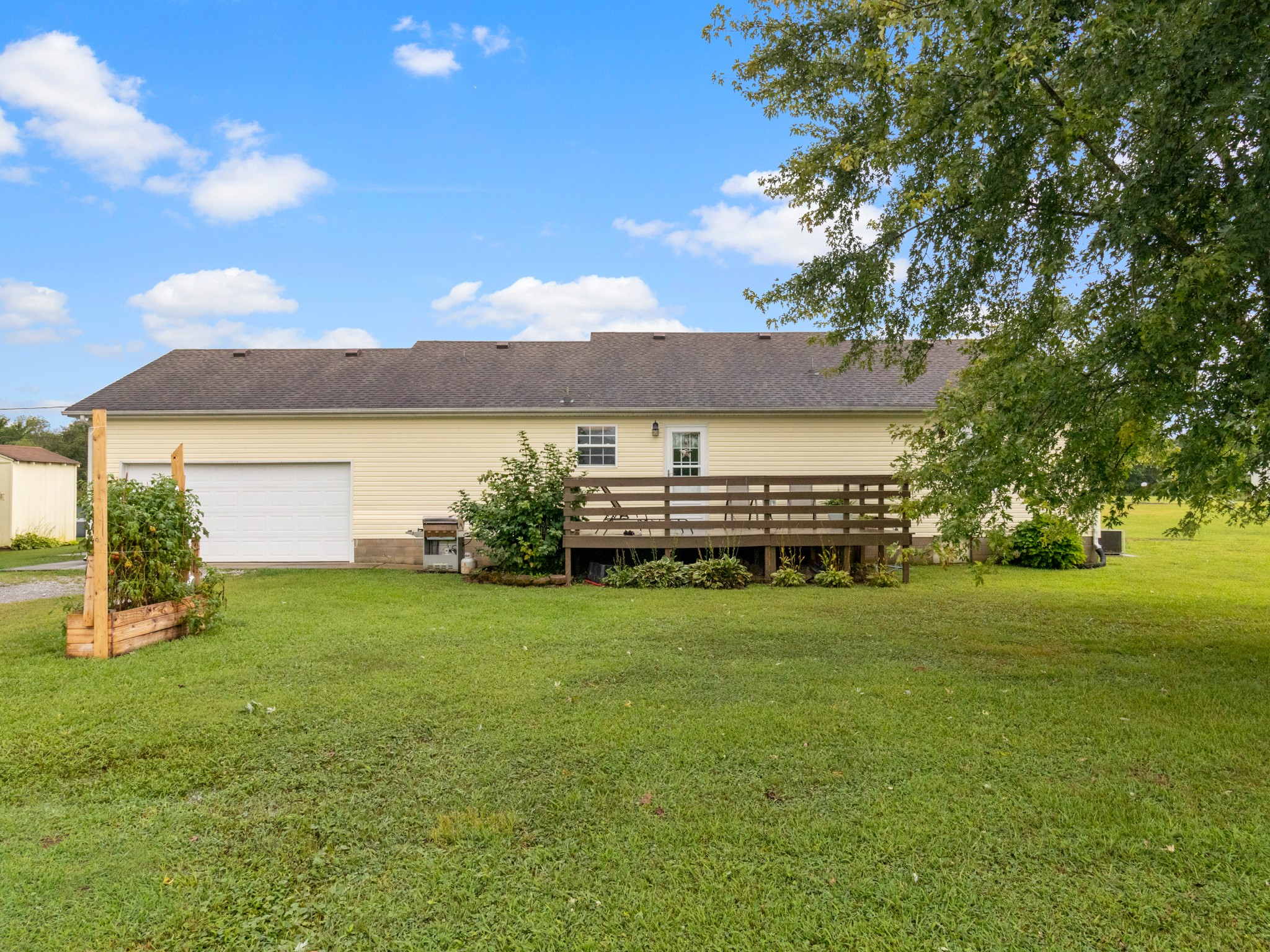 141 Sudberry Road Bell Buckle, TN 37020 - Photo 23 of 33 a view of a house with a garden and yard
