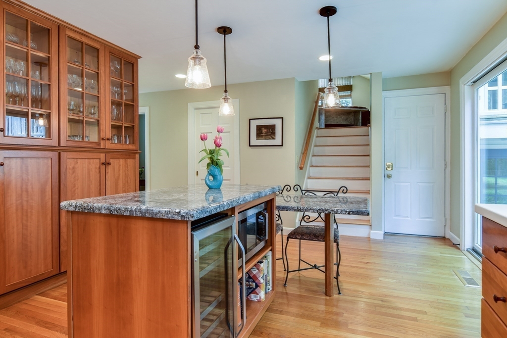 114 Hunters Ridge Road Concord, MA 01742 - Photo 14 of 38 a open kitchen with stainless steel appliances granite countertop a stove and a refrigerator