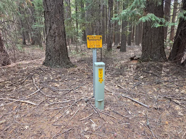 a street sign that is on a rock