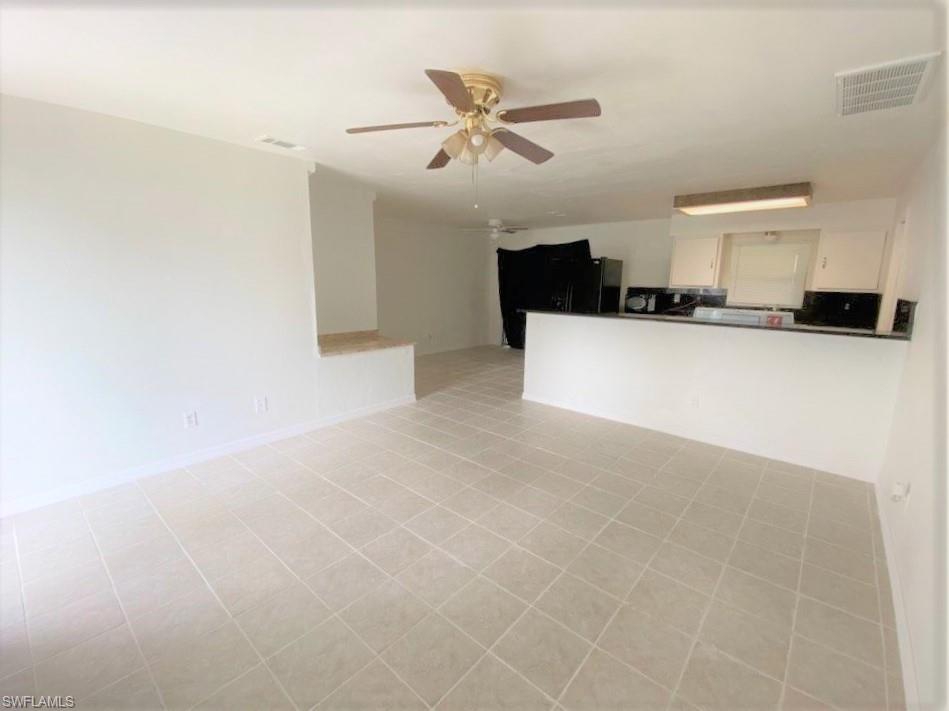 18457 Matanzas Road Fort Myers, FL 33967 - Photo 3 of 9 a living room with furniture and a ceiling fan