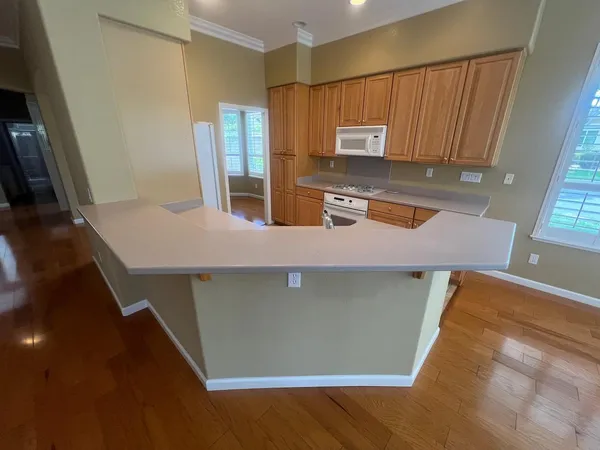 a view of kitchen and wooden floor