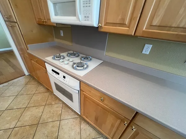 a kitchen with a stove and a microwave
