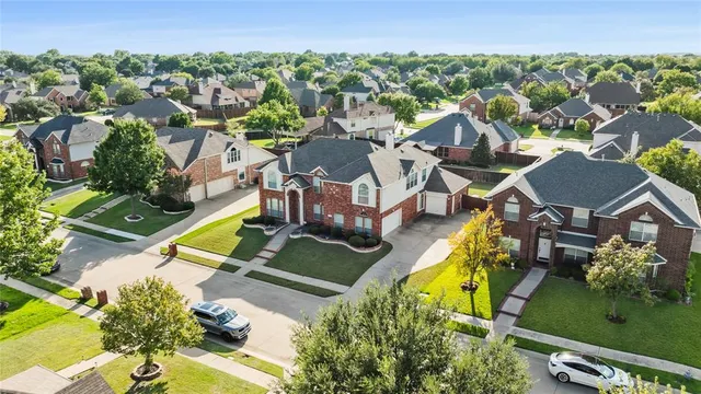 an aerial view of a house with a garden