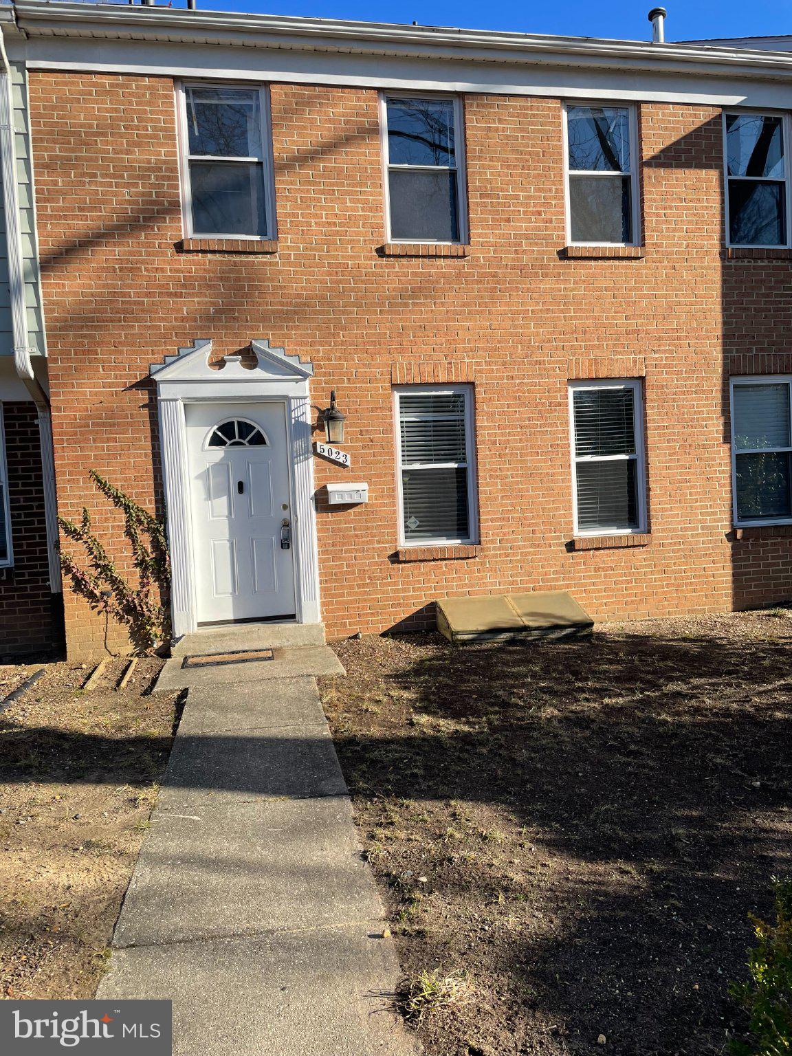Charming brick facade with inviting entry.