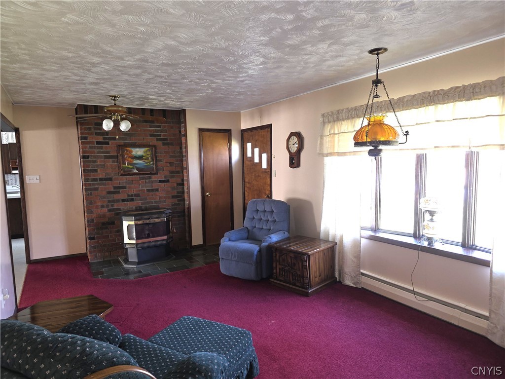 251 Brockway Road Frankfort, NY 13340 - Photo 5 of 27 Living room with Pellet Stove