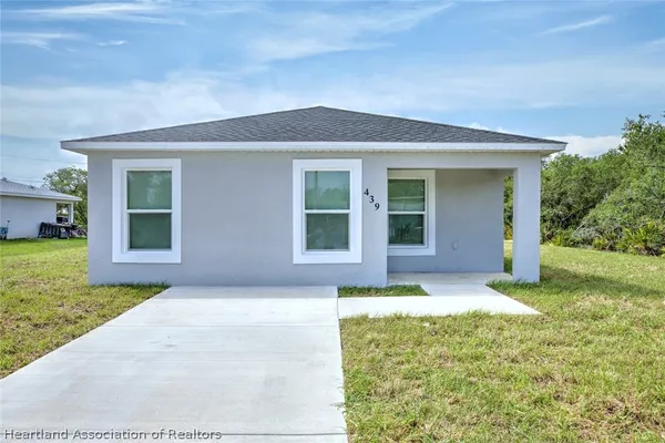 front view of a house with a yard
