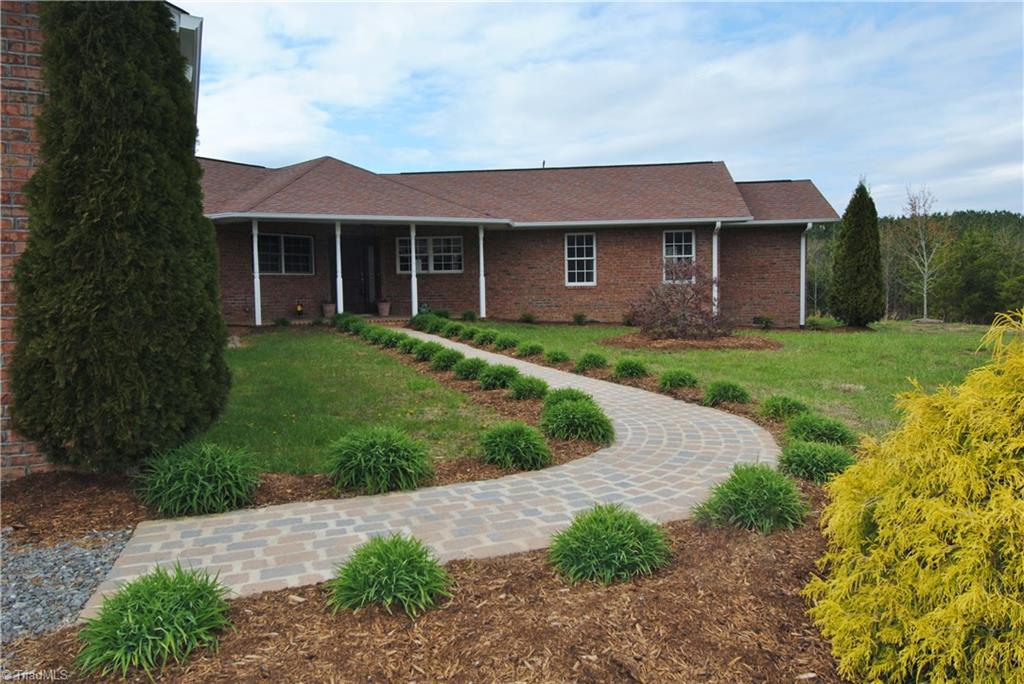 2273 Volunteer Road Pinnacle, NC 27043 - Photo 3 of 30 Front Porch worthy of rocking chairs.
