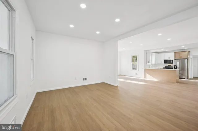 a view of a kitchen with a sink and a window