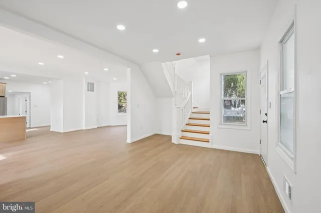 a view of an entryway with wooden floor