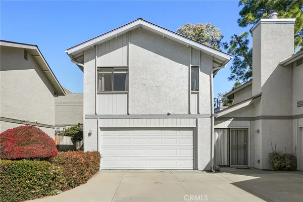 a front view of a house with a garage