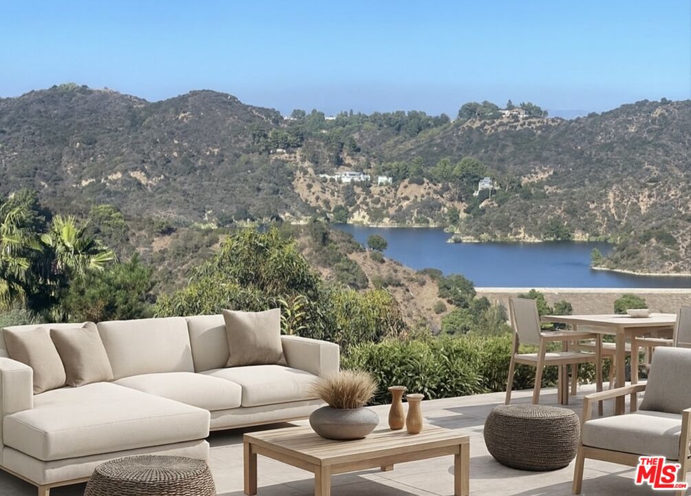 a view of balcony with furniture