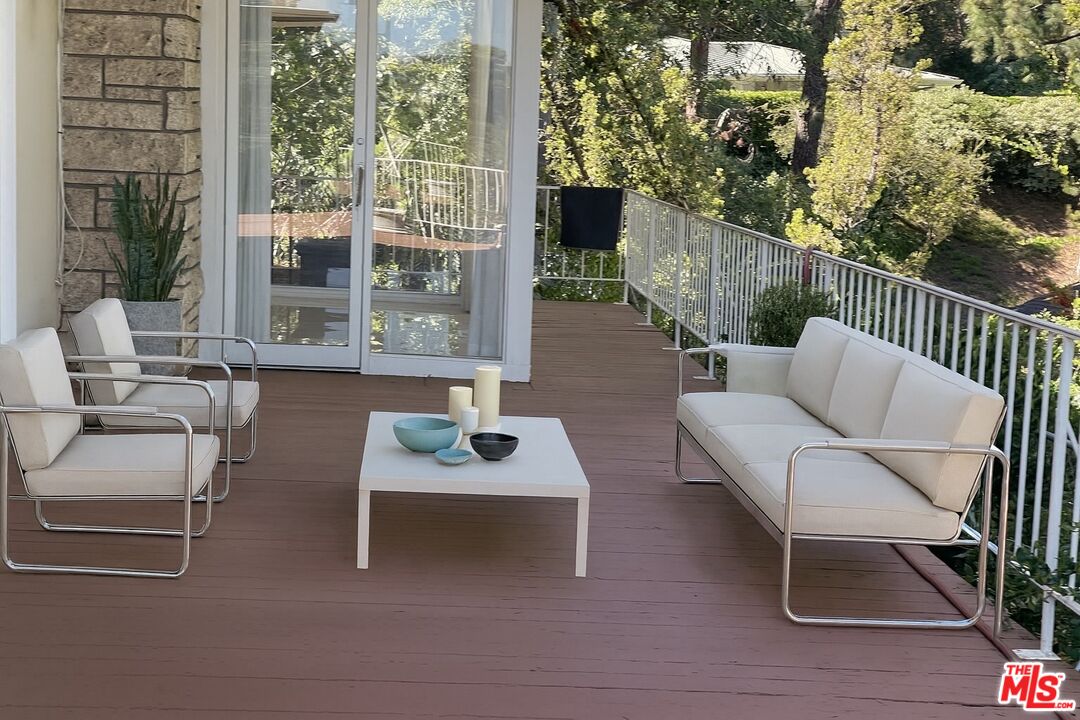 1743 Stone Canyon Road Los Angeles, CA 90077 - Photo 13 of 28 a building outdoor space with patio furniture
