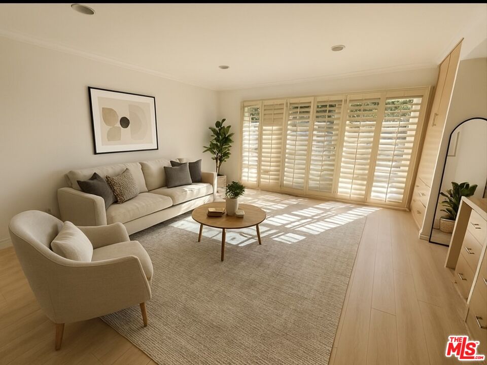 1743 Stone Canyon Road Los Angeles, CA 90077 - Photo 17 of 28 a living room with furniture and a large window