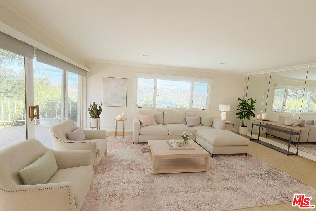1743 Stone Canyon Road Los Angeles, CA 90077 - Photo 22 of 28 a living room with furniture and a large window