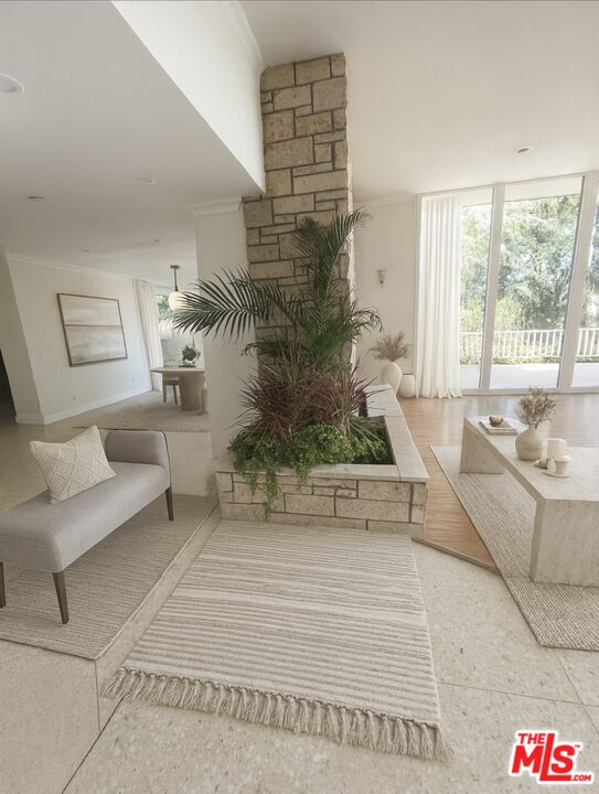 1743 Stone Canyon Road Los Angeles, CA 90077 - Photo 24 of 28 a living room with furniture and a large window