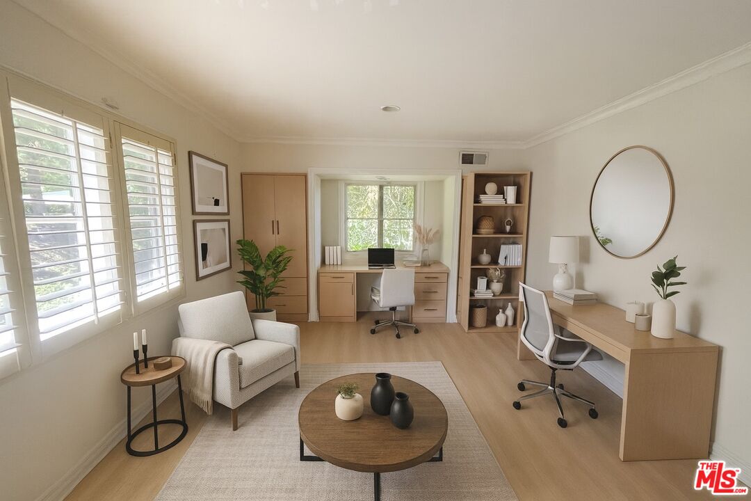 1743 Stone Canyon Road Los Angeles, CA 90077 - Photo 26 of 28 a living room with furniture a large window and a potted plant
