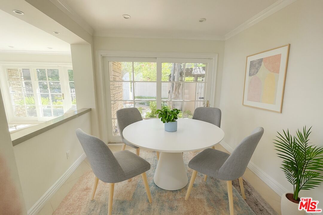 1743 Stone Canyon Road Los Angeles, CA 90077 - Photo 8 of 28 a dining room with furniture and window