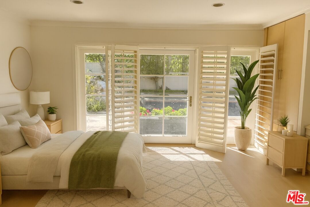 1743 Stone Canyon Road Los Angeles, CA 90077 - Photo 9 of 28 a bedroom with a bed and a window