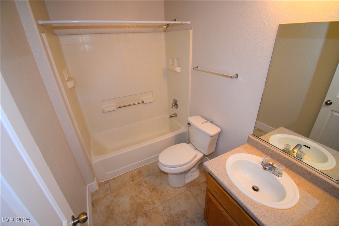 4730 East Craig Road, Unit 2094 Las Vegas, NV 89115 - Photo 4 of 12 Full bathroom featuring shower / tub combination, vanity, and light tile patterned floors