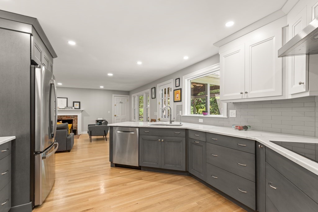 58 Old Coach Road Sudbury, MA 01776 - Photo 11 of 40 a large kitchen with lots of counter space and stainless steel appliances