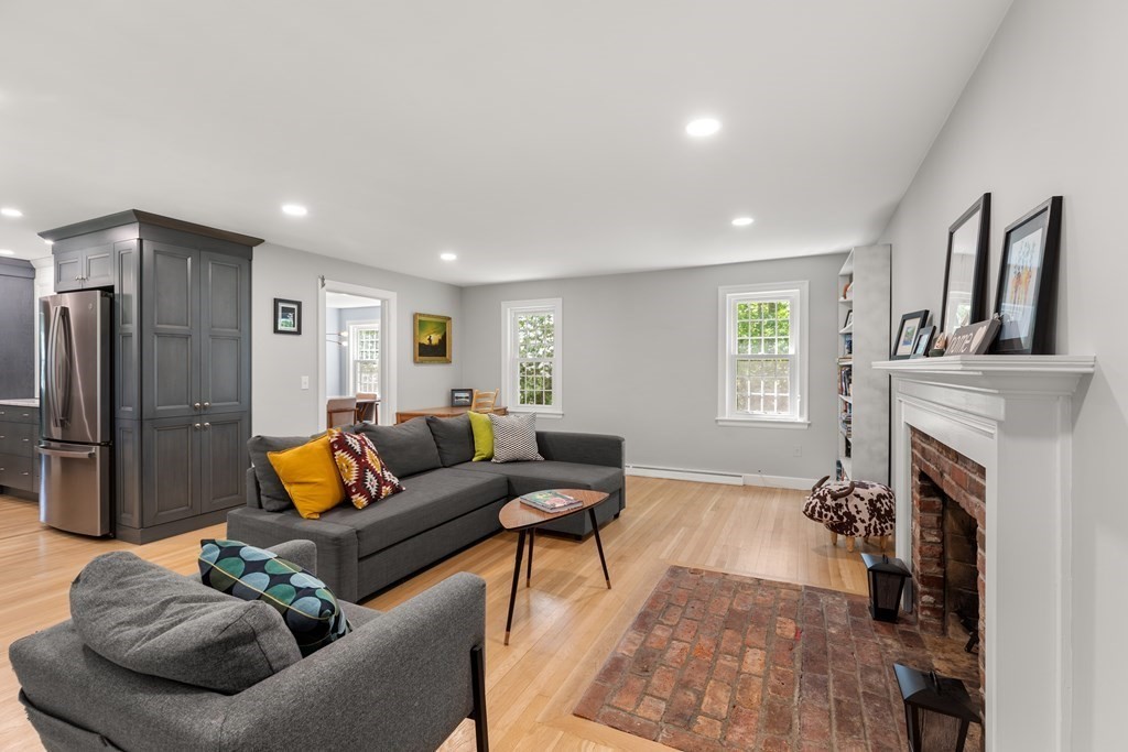 58 Old Coach Road Sudbury, MA 01776 - Photo 15 of 40 a living room with furniture and a fireplace