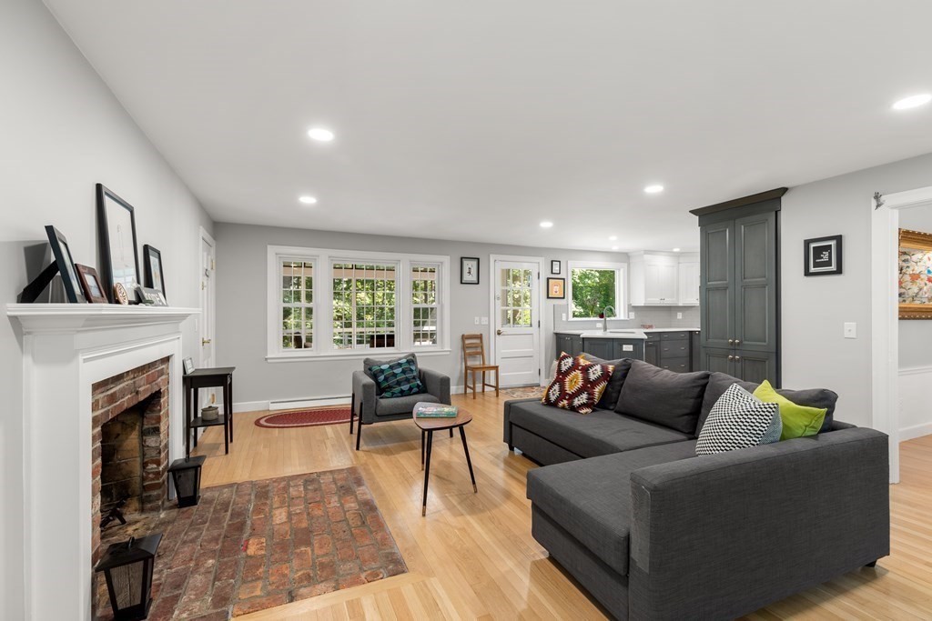 58 Old Coach Road Sudbury, MA 01776 - Photo 16 of 40 a living room with furniture and a fireplace
