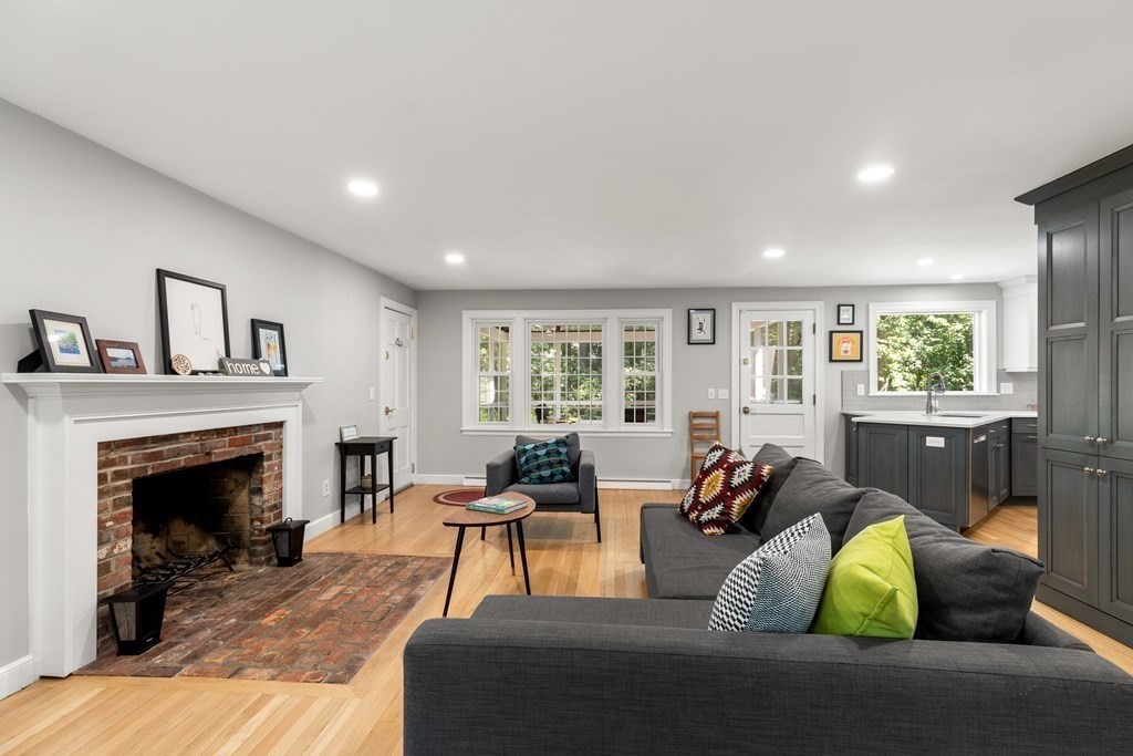 58 Old Coach Road Sudbury, MA 01776 - Photo 17 of 40 a living room with furniture and a fireplace